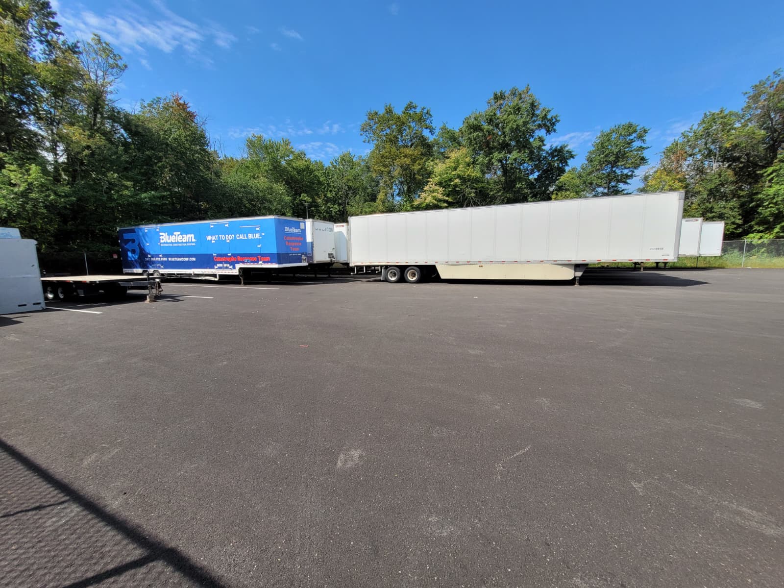 Rows of pallets and containers staged in the yard